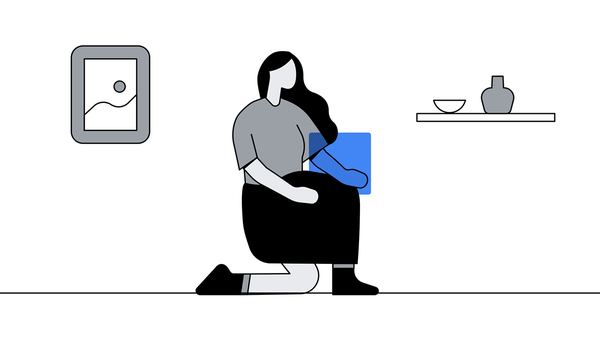 A woman in a half-kneeling position with a photo frame behind and a shelf with pottery before her, representing how protecting customer data and privacy is crucial to build trust and how to create personalized ad experiences with first-party data.