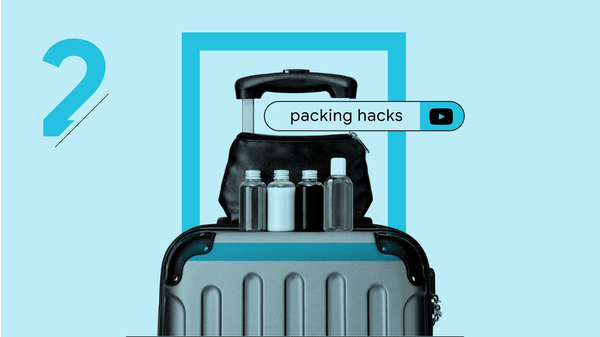 The search term “packing hacks” appears in a YouTube search bar over a toiletry kit resting on top of carry-on luggage. Four travel-size bottles are lined up in front of the kit.